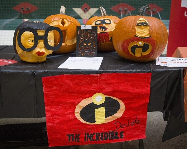 Pumpkins painted, carved and decorated to look like the characters from the movie The Incredibles.
