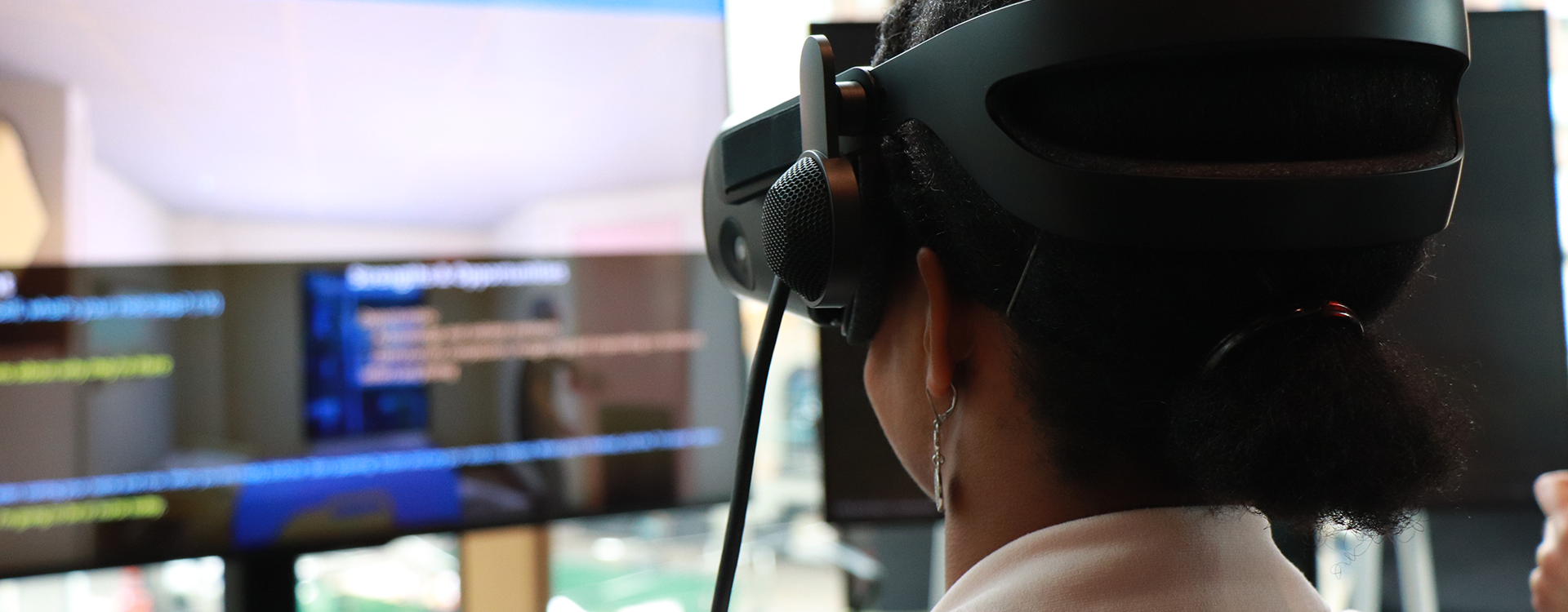 Staff wearing virtual reality headset.