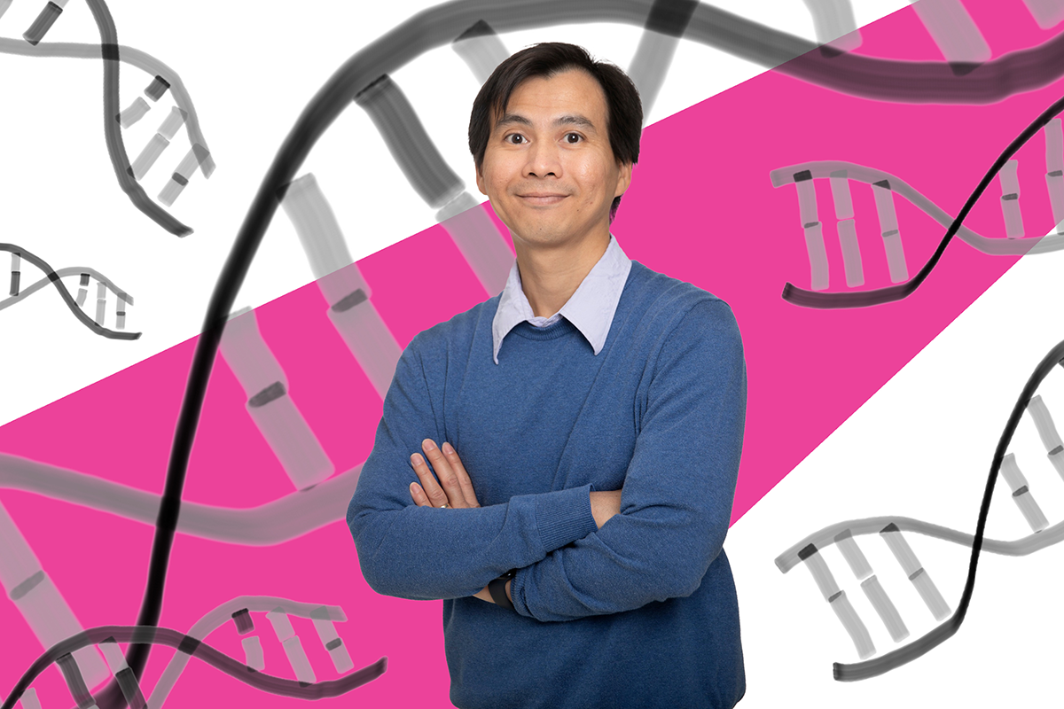 Dr. Toan Nguyen stands with his arms crossed infront of a pink background. 