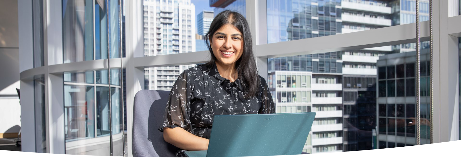 Person seated, using a laptop.