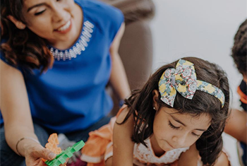 Mother and daughter playing together