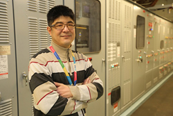 Man stands in an equipment room.