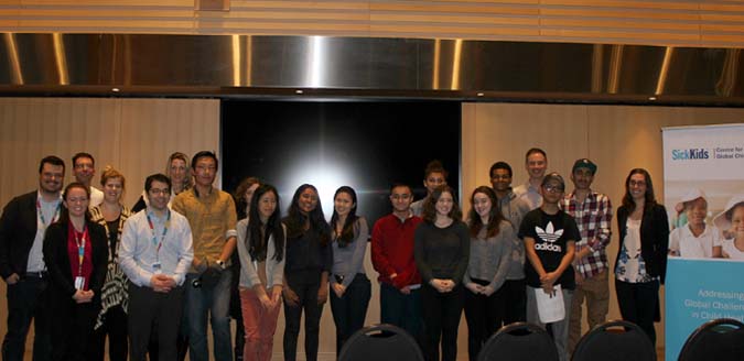 Group stands together in a long line.