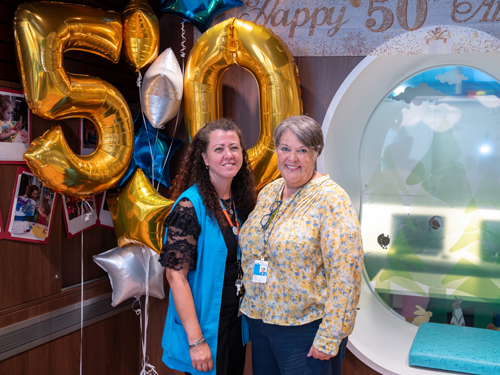 Demelo and Taylor at the WAV PlayPark 50th anniversary celebration