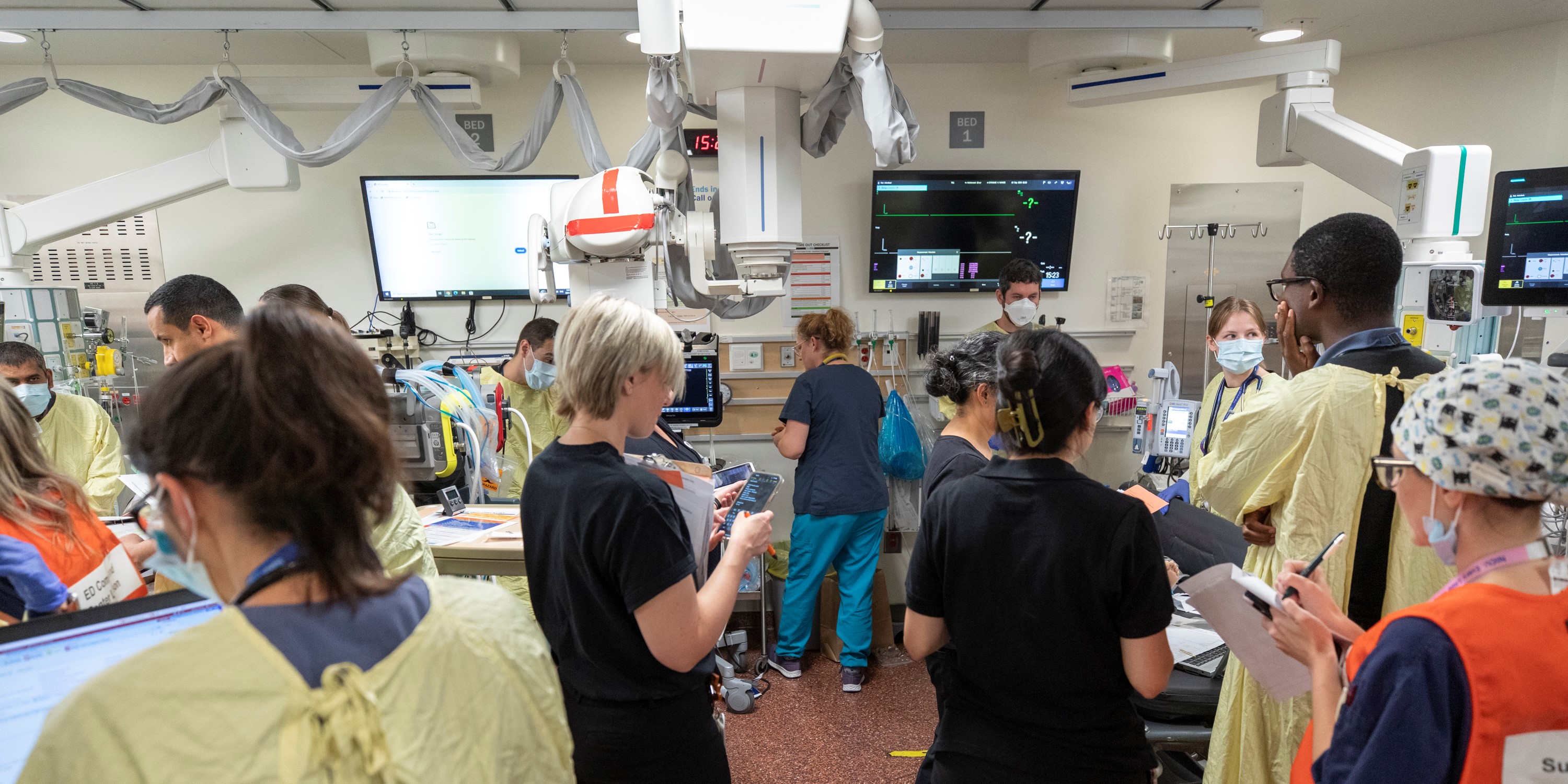 A wide angled shot showing care team in action during a Code Orange simulation in the Emergency Department