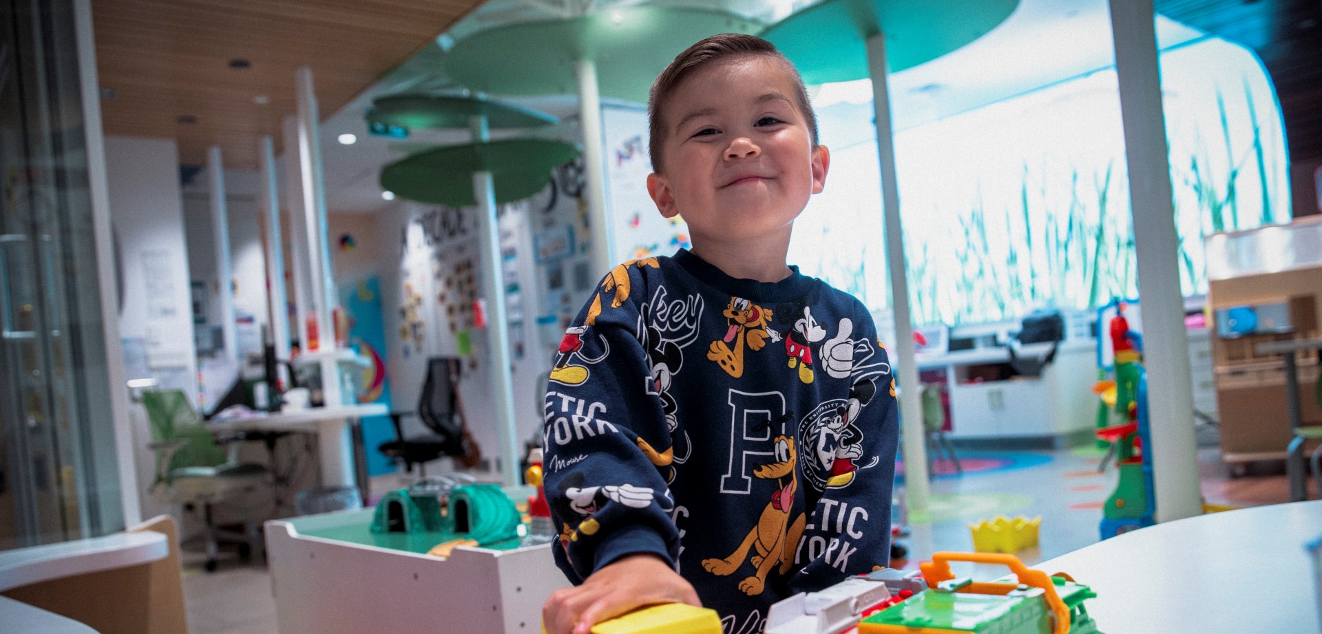 Jayden playing with trucks in the WAV PlayPark