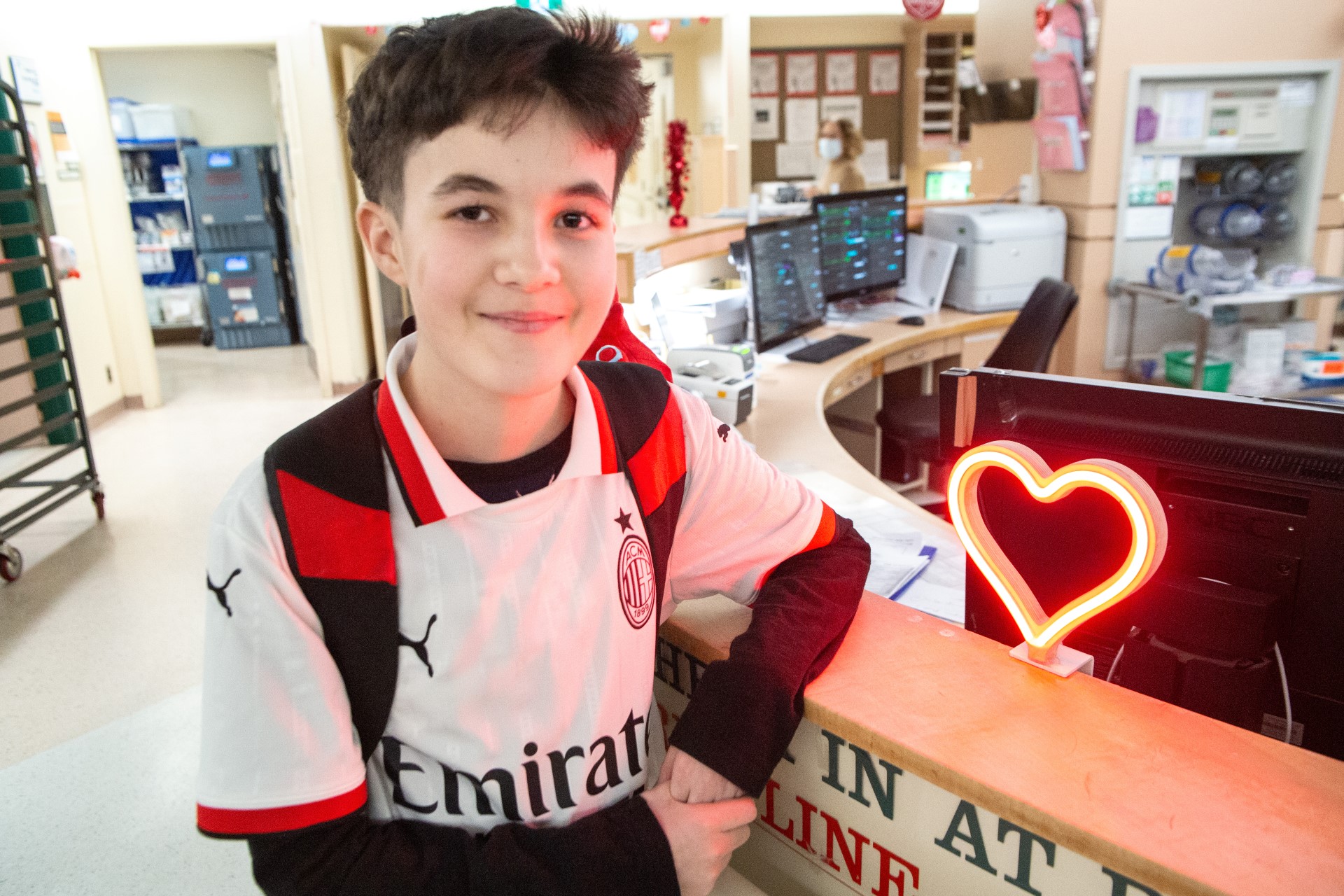 Harrison smiling at the camera at the hospital.