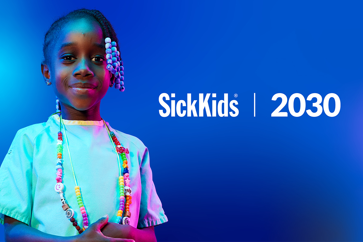 SickKids 2030 logo on a blue gradient background, with a young girl wearing a hospital gown.
